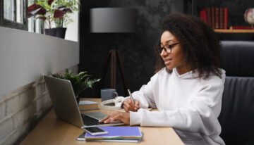 teenager applying for college on her computer