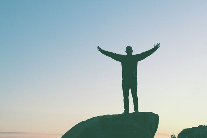 Man on the Cliff Free From Student Loans