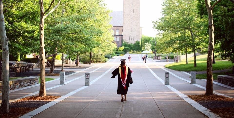 Woman Walking After Graduating