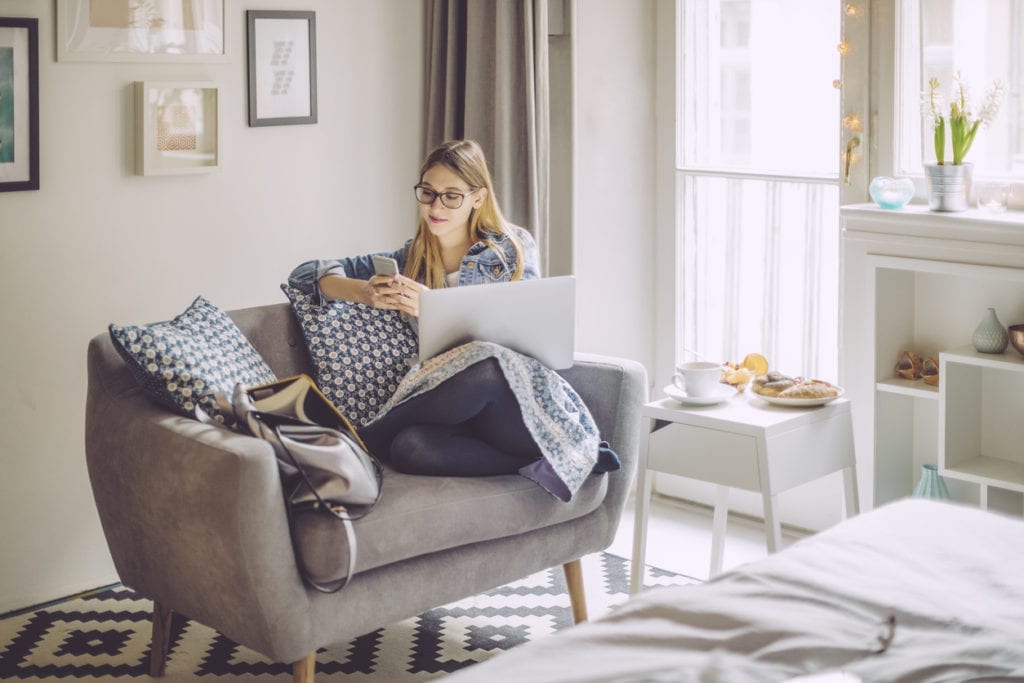 woman reading new about student loans