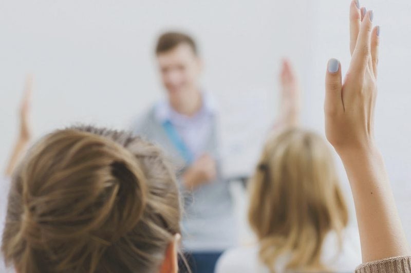 Students Raising Their Hands