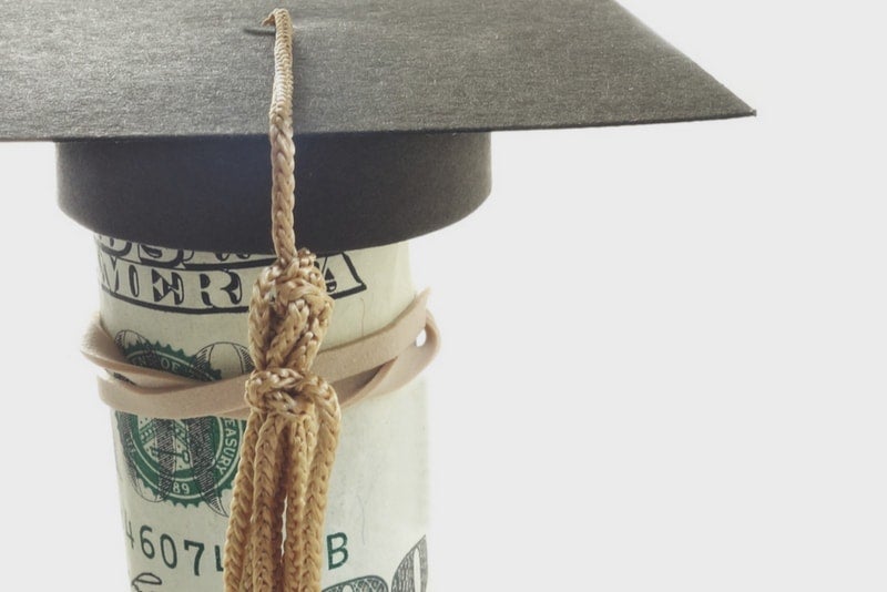 Roll of money wearing a graduation cap