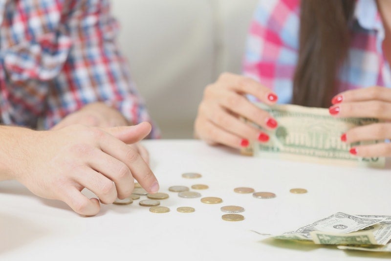 A couple counting their change