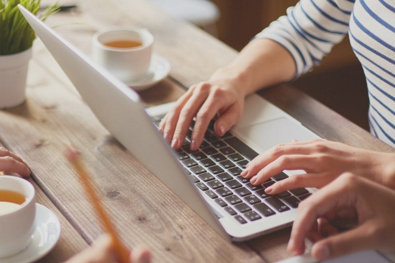 Woman working on financial plans on a laptop