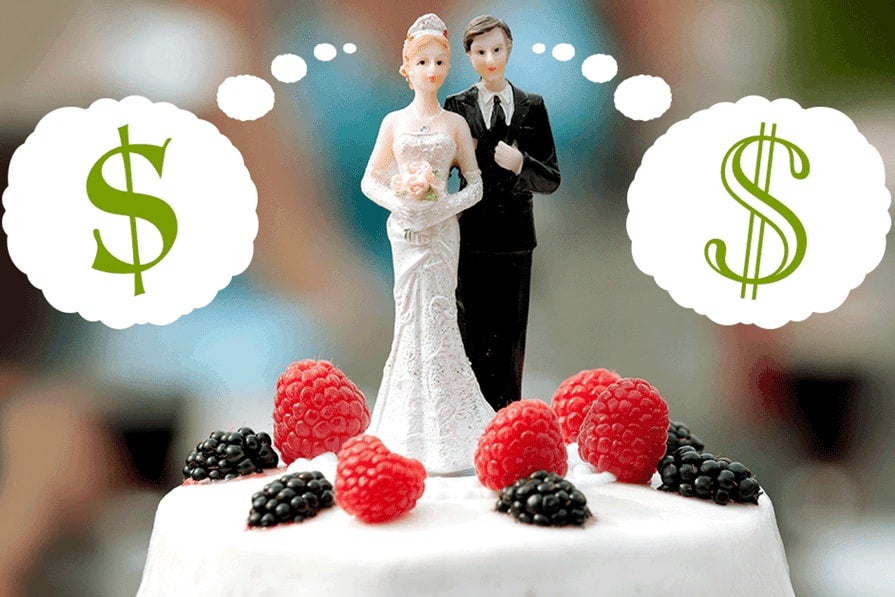 Wedding cake bride and groom toppers worrying about money