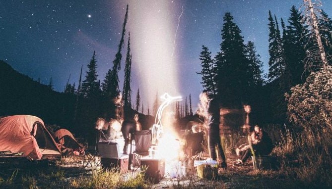 Creepy campfire outside under the stars.