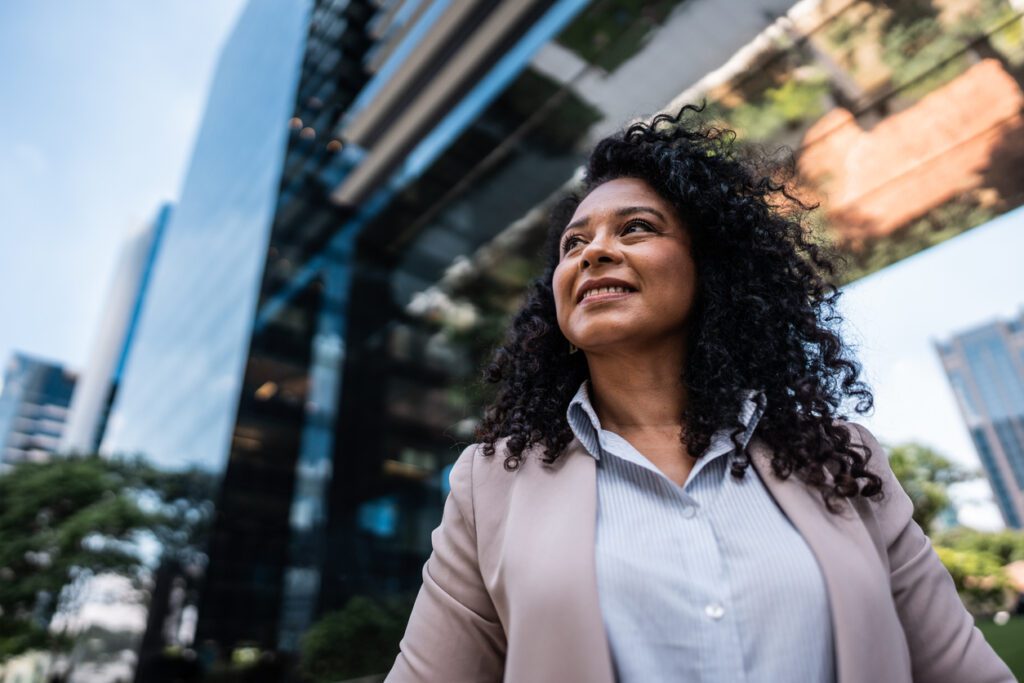 Mature businesswoman looking away contemplating outdoors