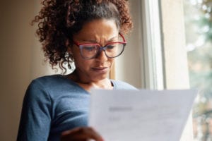 parent reading student loan bill