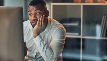 man reading about how student loan debt can affect his career