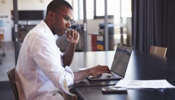 Man researching about discharging refinanced student loans