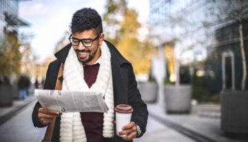 man reading student loan news