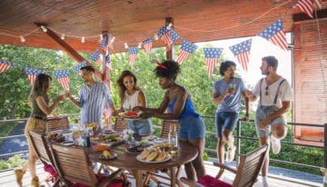Friends celebrating 4th of July with barbecue