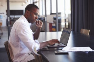 man researching whether to refinance student loans