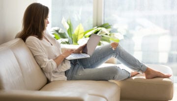 woman reading new about student loans