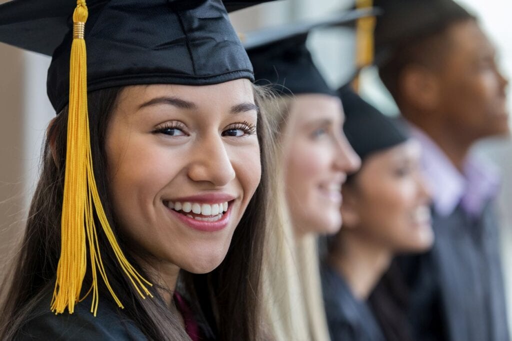 Woman smiling at college graduation