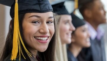 Woman smiling at college graduation