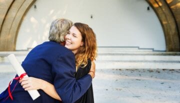 Dad with Parent PLUS loans hugging daughter