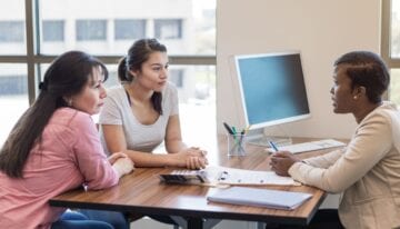 Woman and her cosigner applying for a student loan