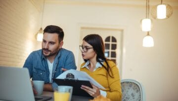 Couple learning how the CARES Act student loan extension affects their payments