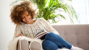Woman reading about how much to spend on rent