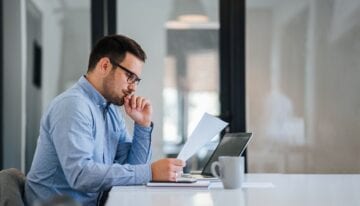 Man deciding which student loan to pay off first