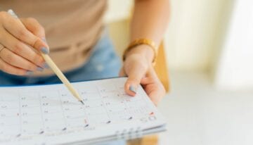 Woman calculating how quickly you can get a student loan