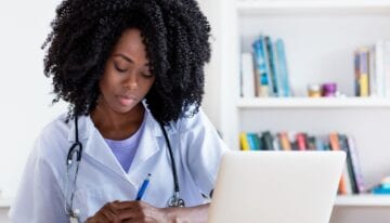 Woman budgeting on a medical fellowship salary
