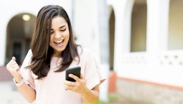 Woman celebrating after getting a scholarship