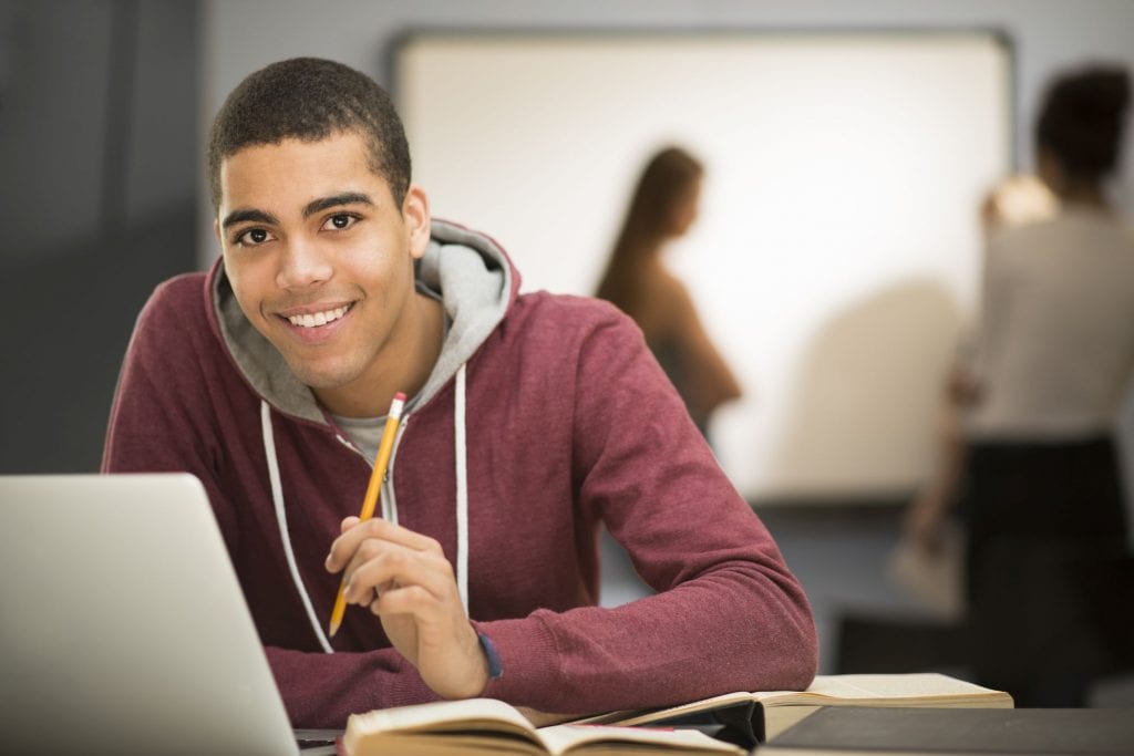 male student at desk
