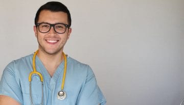 Young male nurse with glasses