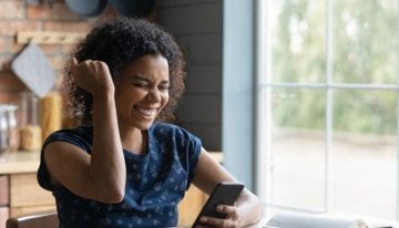 young african american woman celebrating