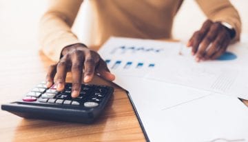 african american using calculator