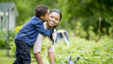 son kissing mother on cheek