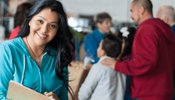 Woman smiling working at nonprofit organization.