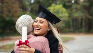 Woman with Parent PLUS Loans hugging graduate daughter