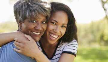 Mother with adult daughter in the park