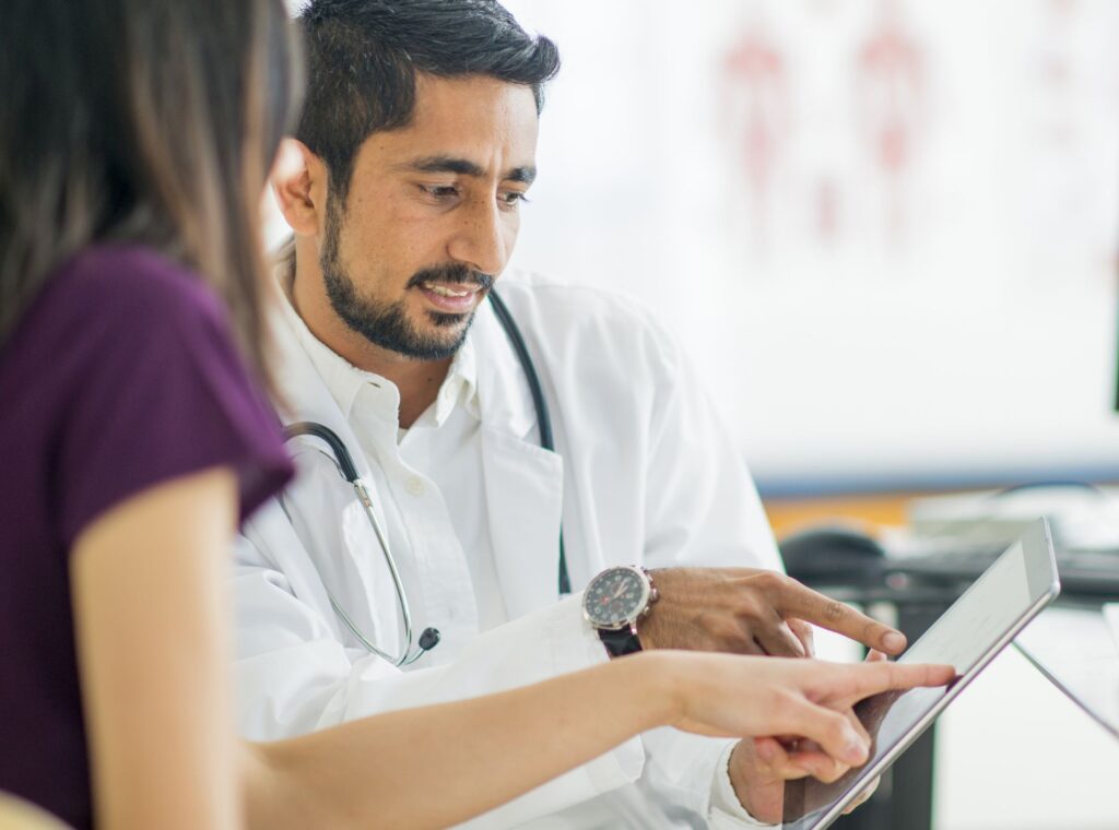 Male doctor talking to patient