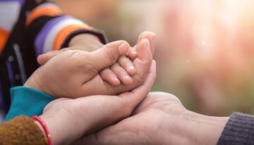 Father's mother's and baby's hand