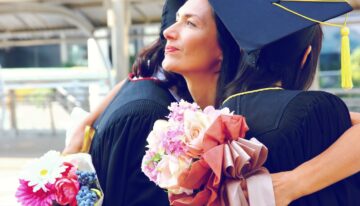 Woman with Parent PLUS loans hugging college graduate