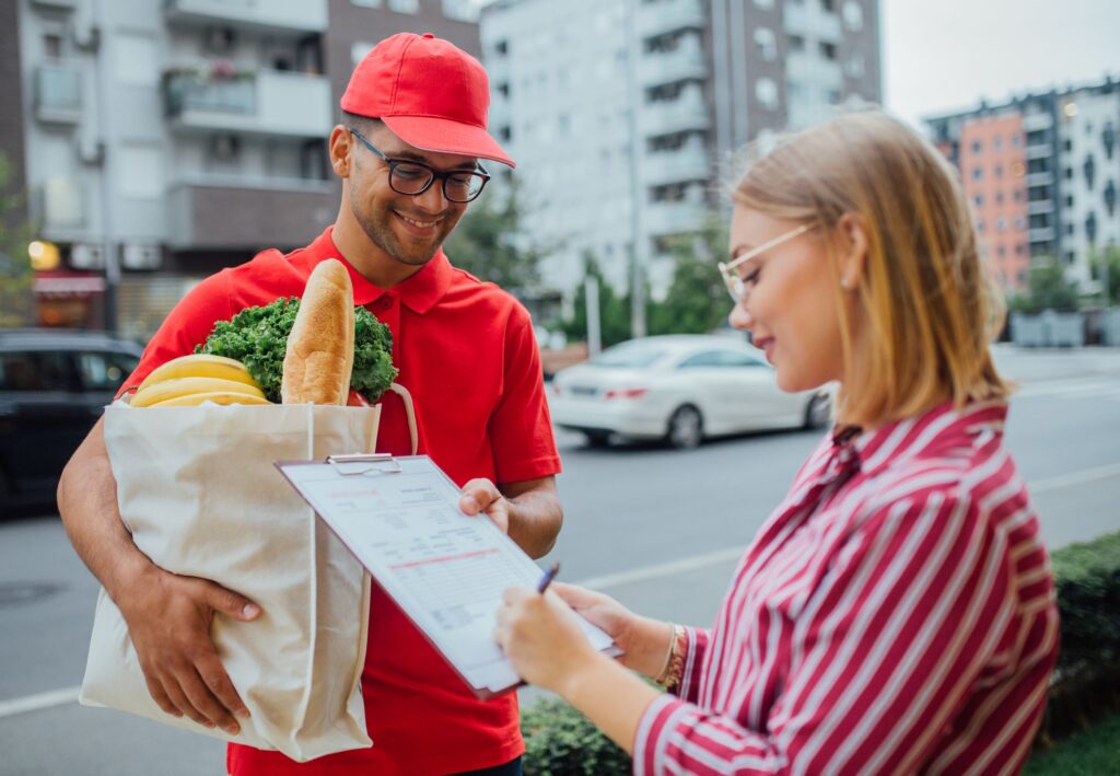 Student working a grocery delivery side hustle to help pay student loans