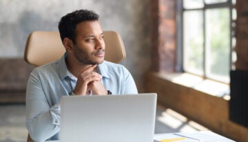 Man contemplating if he should use his 401k to pay off student loans