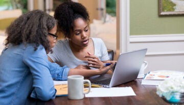 Parent works with daughter to plan out monthly college allowance.