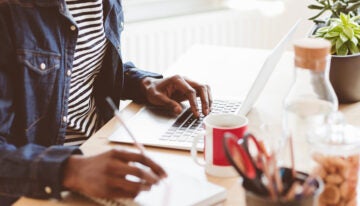 Man with student loans researching if he is eligible for loan forgiveness after 20 years