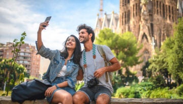 Young adults traveling with student loans.