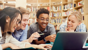 Group of high school students searching fun and unique scholarships.