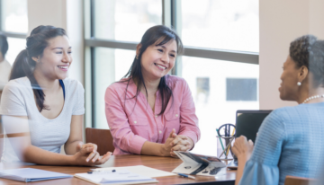 Mother and daughter learning about cosigning a student loan.