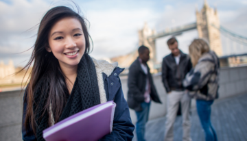 Young Asian woman using student loans to study abroad.