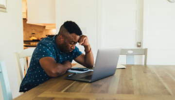 Man having anxiety about student loans.