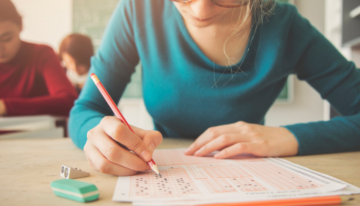 Young female student taking ACT test.