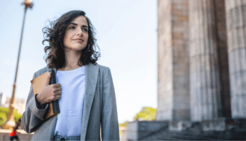 Young female law student standing outside.